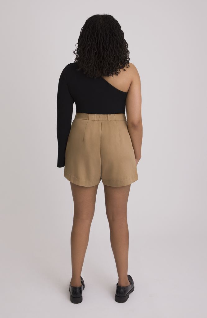 The Anywhere Short sits snug at the high waist with a roomy fit for full hips. Shown here is the back view in classic tan.