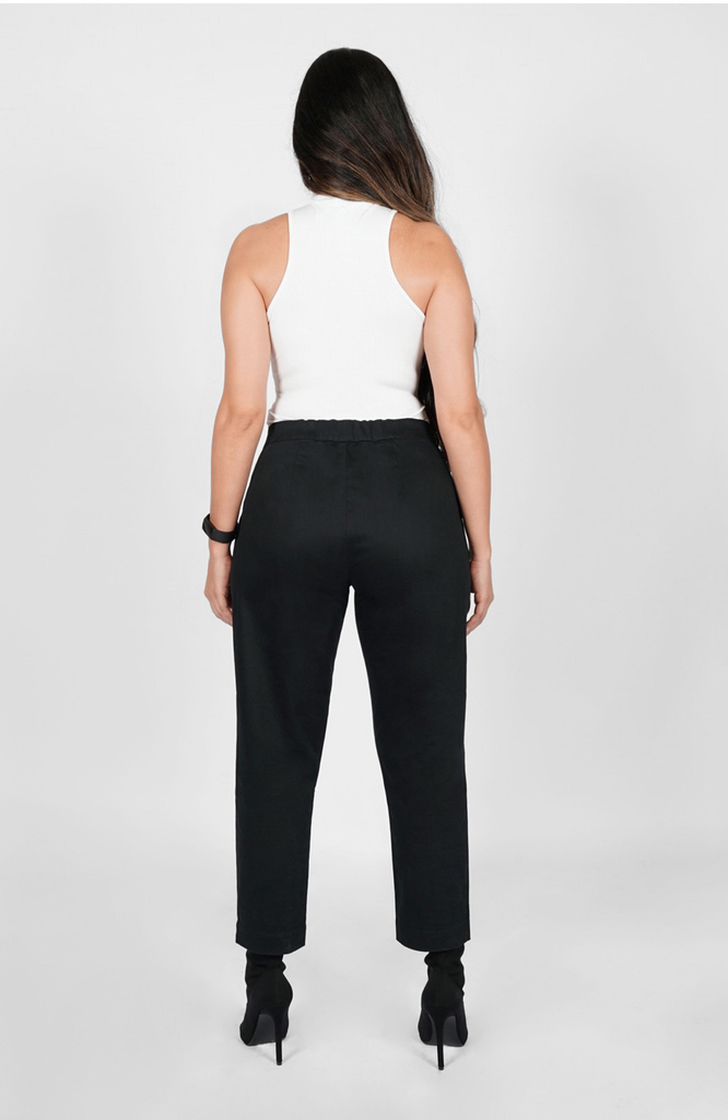 The fit through the seat, hips and thighs is unparalleled, particularly for women with fuller bottom shapes. The pant also features a back elastic for comfort fit at the high waist. It's shown here in classic black.