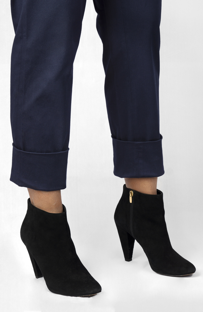 The Flex Waist Pant by Aam The Label comes with a 4" hem for easy cuffing and lengthening. It’s shown here in navy blue.
