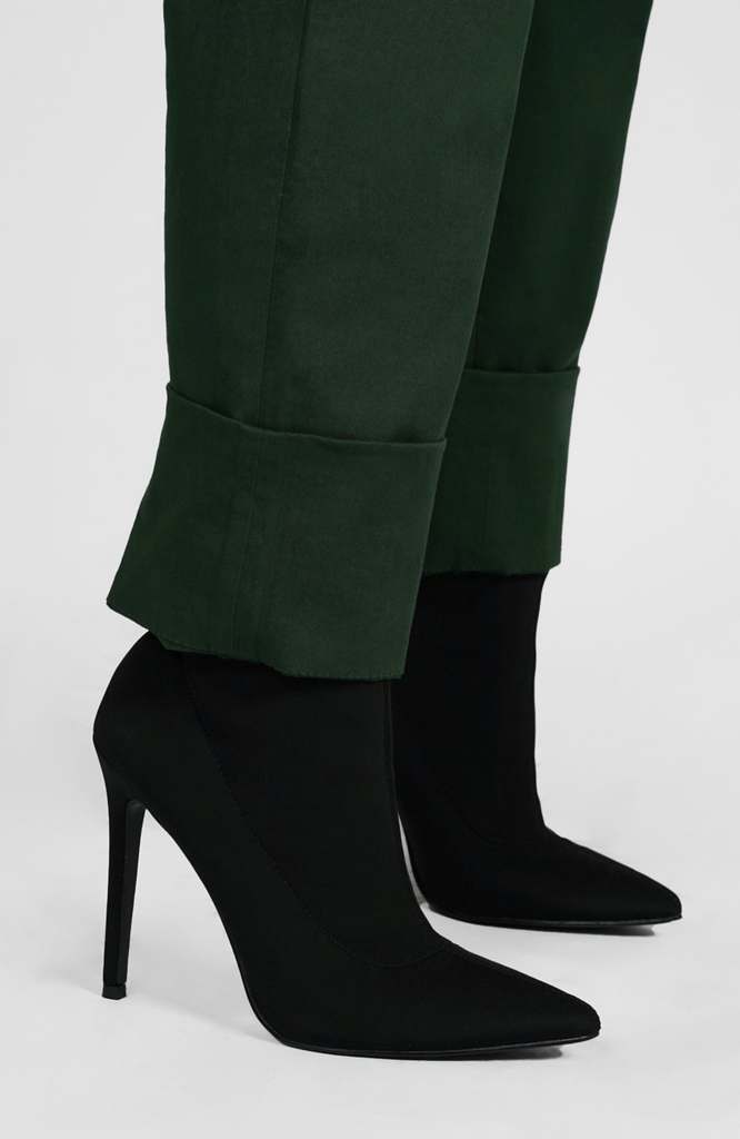 The Flex Waist Pant by Aam The Label comes with a 4" hem for easy cuffing and lengthening. It’s shown here in a classic forest green shade.