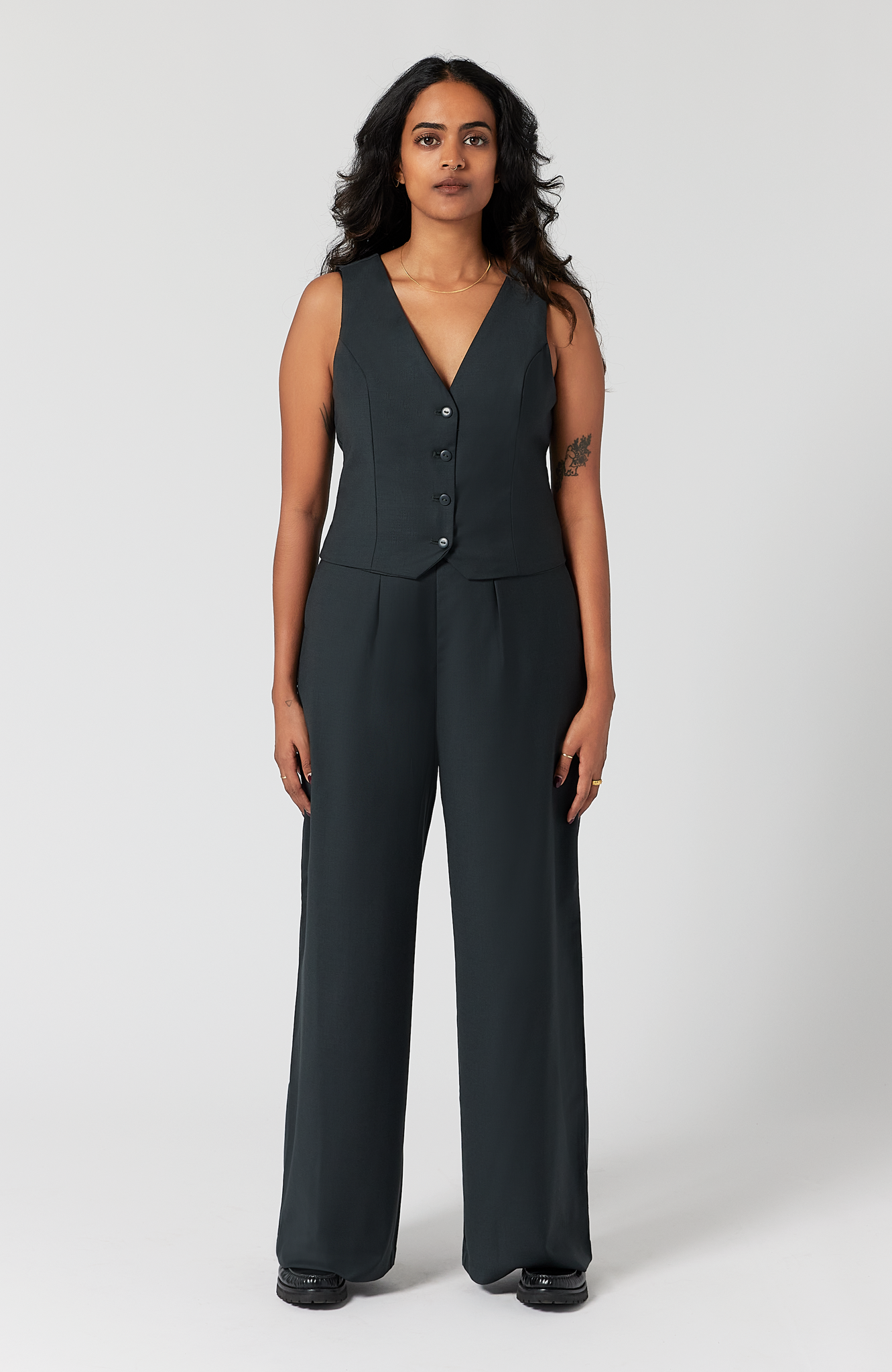 The pant has a beautiful drape on women with pear and hourglass shapes. It comes with a matching vest that can be purchased separately or together as a set. The set is shown here in a classic charcoal.