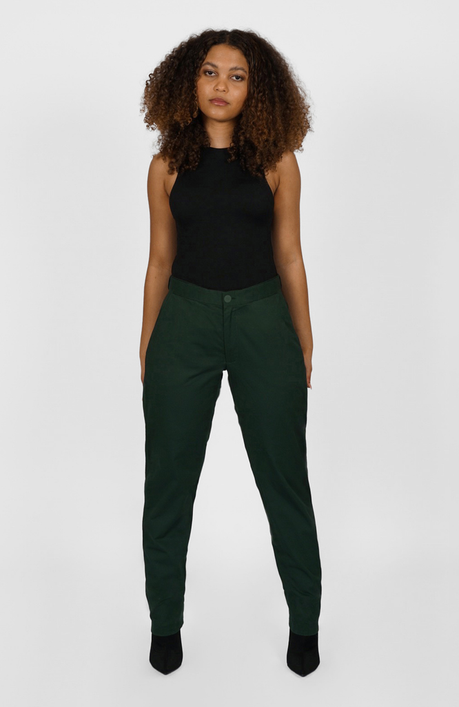 The Flex Waist Pant by Aam The Label is a chic, cotton trouser with a hidden expandable waistband that provides 2-3" of stretch at the waist and a comfortable fit - even on your off days. It is made from a breathable, 98% organic cotton with 2% stretch and is fully machine washable. The pant also has a 4" hem which makes it easy to lengthen or cuff, as needed. The Flex Waist Pant comes in two colors - navy blue and forest green (pictured here).