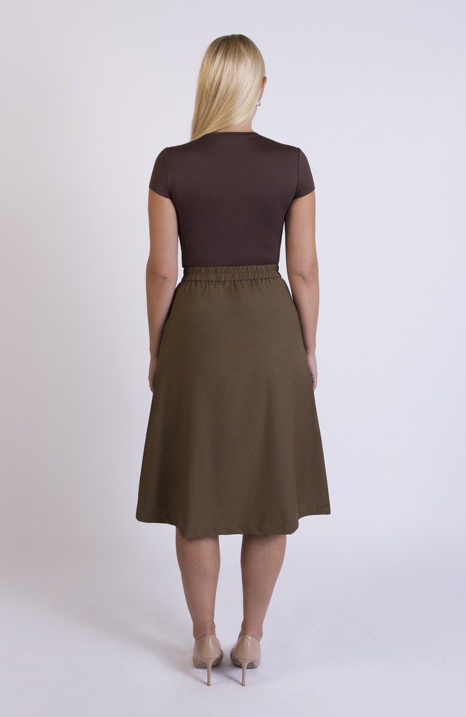 The Wool Midi Skirt by Aam The Label has a discreet back elastic that provides comfort at the waist and eliminates waist gaps. Shown here in Cocoa.
