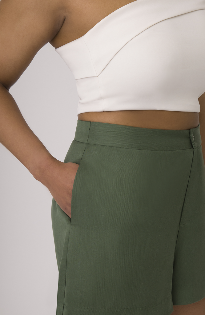 The Anywhere Short features deep, functional pockets that comfortably fit your whole hand, most smartphones or a small wallet. Shown here in forest green.