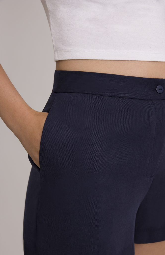 The Anywhere Short features deep, functional pockets that comfortably fit your whole hand, most smartphones or a small wallet. Shown here in classic navy.