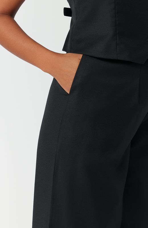 The pant features deep, functional pockets that comfortably fit your whole hand, a smartphone or a small wallet. It is shown here in the classic black shade.