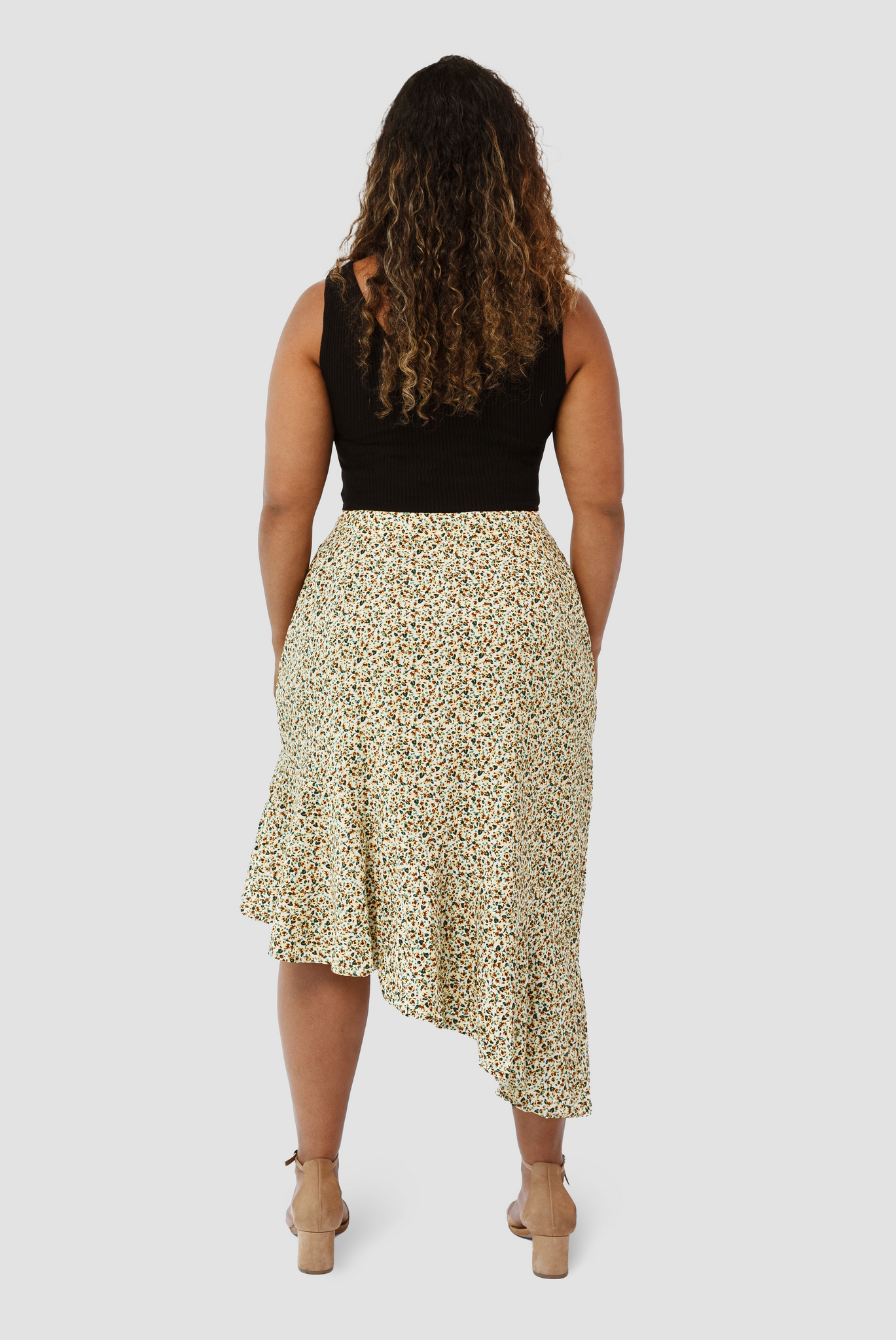 The Cascade Skirt by Aam is designed to sit snug at the waist with more room for full hips and thighs. In this image you can see the back view.