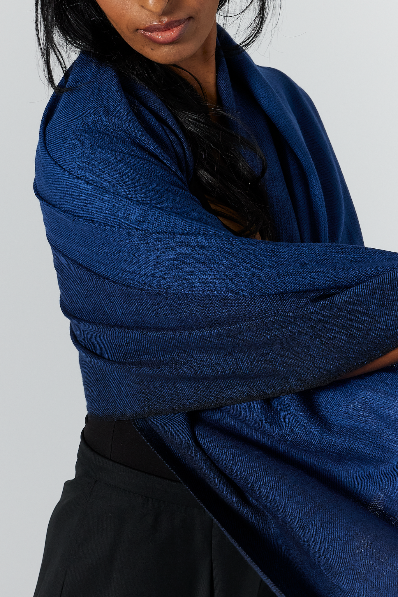 The Aurora Wrap can also be draped as a shawl. It measures 77” x 38”. It is shown here in the midnight color.