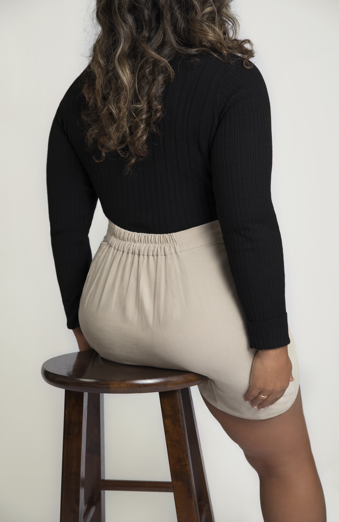 The skirt eliminates waist gaps with a small center back elastic that cinches the skirt at the natural waist. Shown here in gorgeous, neutral, off-white.