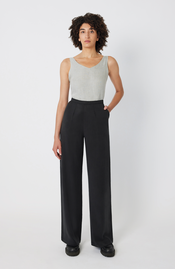 The Tall Wide Leg Pant by Aam The Label is made for women with full hips and thighs. Featuring a 34" inseam, this bestselling style is perfect for tall women looking for a true full length trouser with exceptional fit. It's shown here in a classic washed black color.