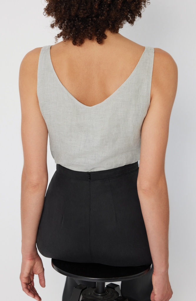 The Tall Wide Leg Pant is designed with a waist-to-hip ratio specifically for pear and hourglass shapes, eliminating waist gaps. It’s shown here in a classic washed black color.