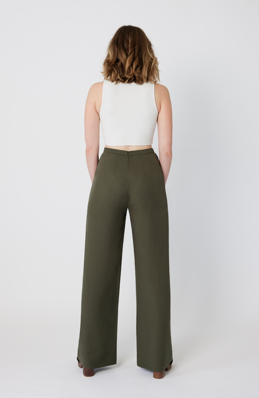 The Tall Wide Leg Pant sits snug at the high waist with a roomy fit through the hips and thighs. It features a long, hidden back zipper for ease of wear and a snatched fit through the waist, completely eliminating waist gaps. It’s shown here in a washed olive color.
