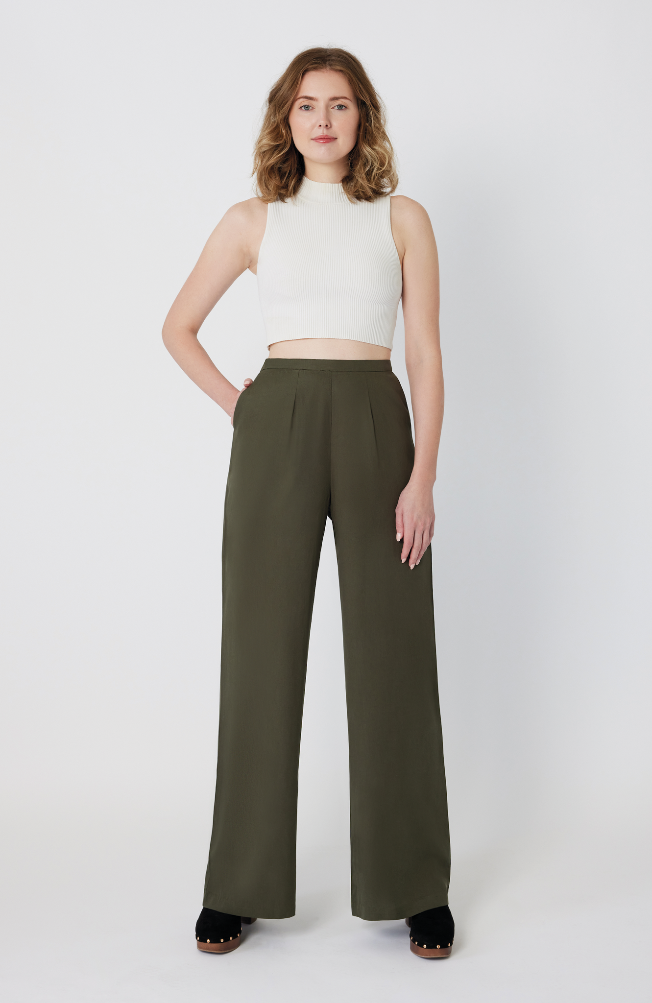 The Tall Wide Leg Pant by Aam The Label is made for women with full hips and thighs. Featuring a 34" inseam, this bestselling style is perfect for tall women looking for a true full length trouser with exceptional fit. It's shown here in a washed olive color.