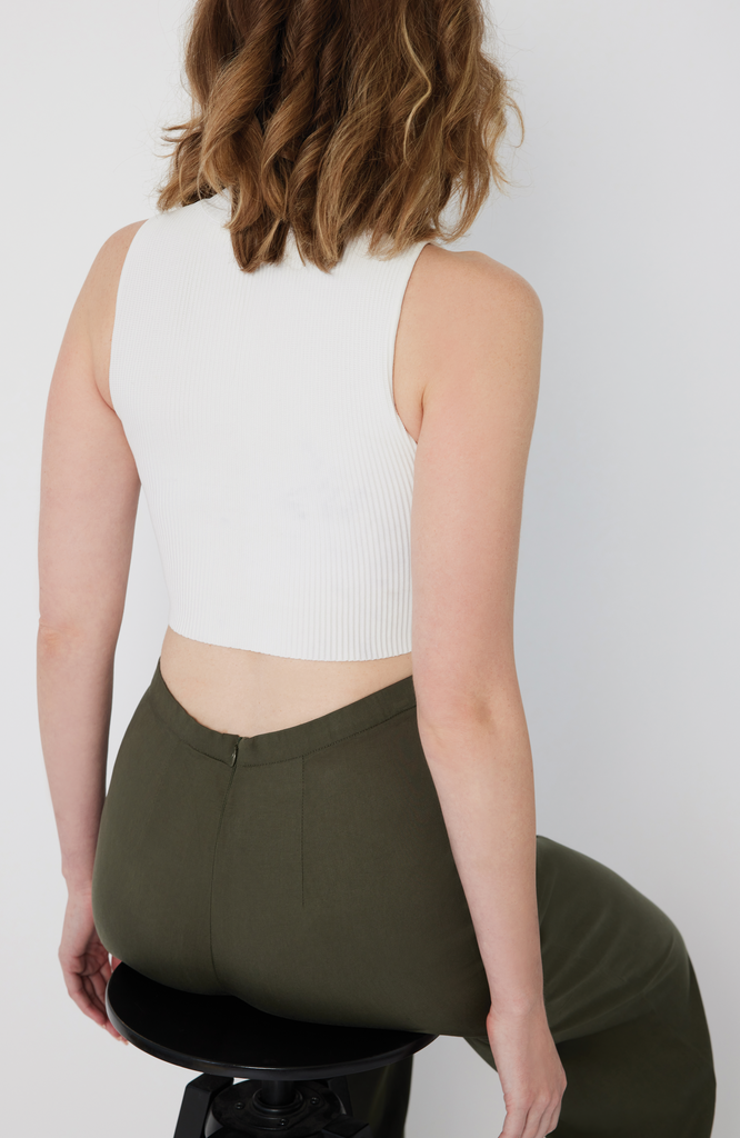 The Tall Wide Leg Pant is designed with a waist-to-hip ratio specifically for pear and hourglass shapes, eliminating waist gaps. It’s shown here in a washed olive color.