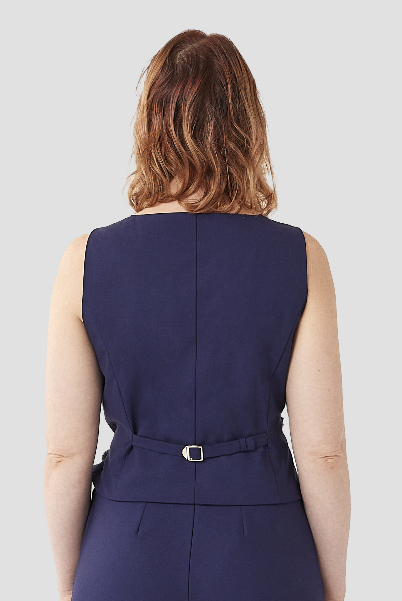 The Wool Vest by Aam comes with an adjustable back strap to cinch the waist for a just-right fit.