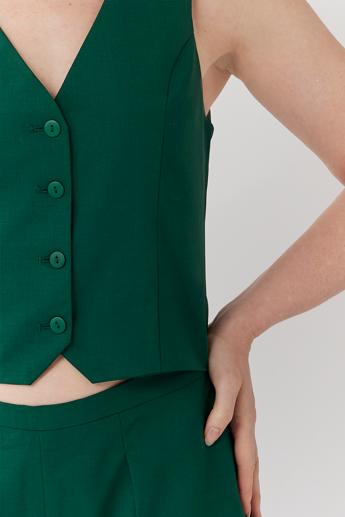 Sleek and clean with impeccable attention to detail, The Wool Vest features tone-on-tone buttons and a slimming fit through the waist.