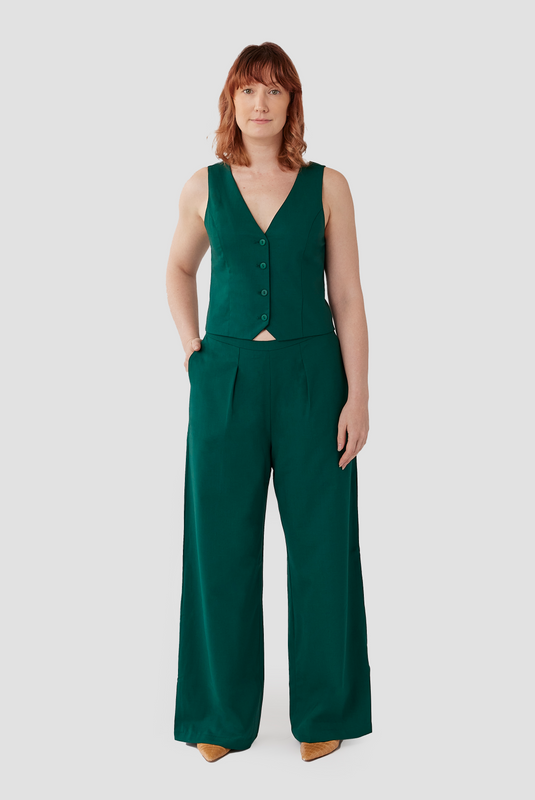 The Wool Vest is a beautiful, striking cropped vest made from a warm 96% wool and 4% stretch for comfort. It is fully lined with a smooth organic cotton lining, and pairs perfectly with the high waisted Wool Wide Leg Pant by Aam. Shown here is the stunning emerald green color.