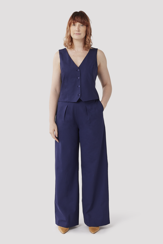 The Wool Wide Leg Pant by Aam is made for women with full hips and thighs. It sits at the high waist with a roomy fit for curvy bottom shapes. It also has deep, functional, inseam pockets. It's ethically and sustainably made using a wonderfully soft 96% wool fabric with 4% stretch for comfort. The pant is fully lined for a soft, breathable finish on the skin. Featured here is The Wool Wide Leg Pant in a vibrant indigo color.