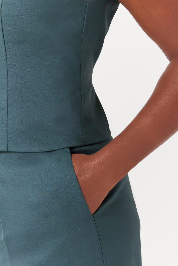 The Wool Wide Leg Pant features deep, functional, inseam pockets that comfortably fit your whole hand.