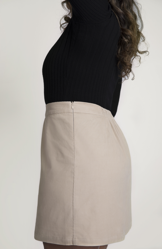 The skirt features hidden zipper closure for a seamless finish, shown here in a gorgeous, neutral, off-white.