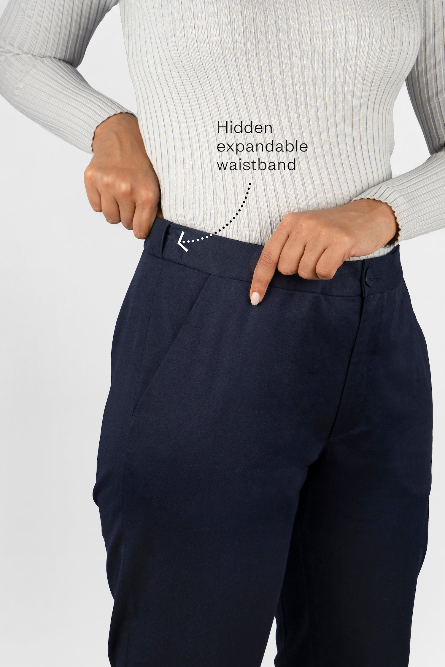 The Flex Waist Pant by Aam is a chic, cotton trouser with a hidden expandable waistband that provides 2-3