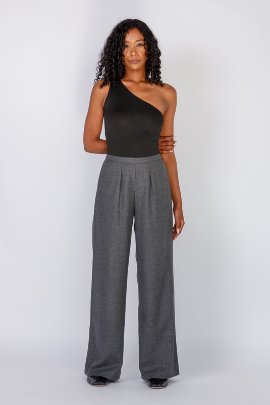 The Limited Edition Wool Wide Leg Pant by Aam is made for women with full hips and thighs. It has a waist nipping rise, large pockets and a chic, boho fit that drapes beautifully on fuller hips. The pant is shown with a front view here. It comes in two colors - grey (pictured here) and black and is made from butter-soft 97% wool and 3% stretch.