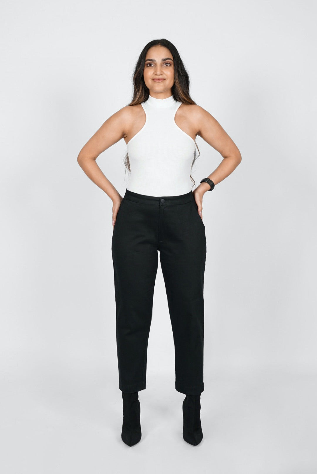 The Crop Pant by Aam is a relaxed, cotton trouser designed for women with full hips and thighs. It's made from a butter-soft, 98% organic cotton with 2% stretch. Big pockets allow you to comfortably slide your hands or phone, and a small back elastic provides comfort at the waist. The Crop Pant comes in two colors - black (pictured here) and beige.