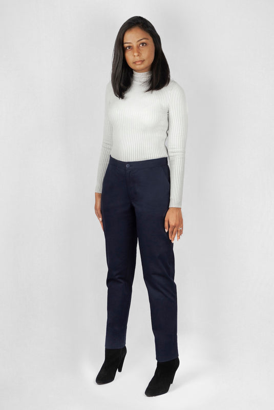 The Flex Waist Pant by Aam is a chic, cotton trouser with a hidden expandable waistband that provides 2-3" of stretch at the waist and a comfortable fit - even on your off days. It is made from a breathable, 98% organic cotton with 2% stretch and is fully machine washable. The pant also has a 4" hem which makes it easy to lengthen or cuff, as needed. The Flex Waist Pant comes in two colors - navy blue (pictured here) and forest green.