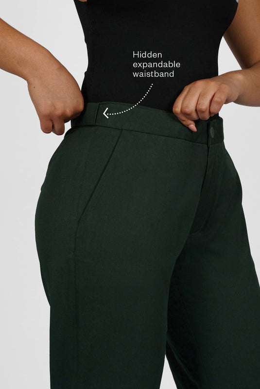 The Flex Waist Pant by Aam is a chic, cotton trouser with a hidden expandable waistband that provides 2-3" of stretch at the waist and a comfortable fit - even on your off days. It is made from a breathable, 98% organic cotton with 2% stretch and is fully machine washable. The pant also has a 4" hem which makes it easy to lengthen or cuff, as needed. The Flex Waist Pant comes in two colors - forest green (pictured here) and navy blue.