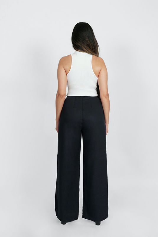 The Wide Leg Pant by Aam is made for women with full hips and thighs. This is the back view of the pant, which shows the fit at the waist, hip and thigh. The pant comes in two colors - black (pictured here) and mauve.
